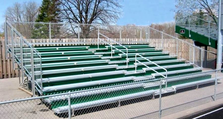 The spectator protective fencing of this baseball field is made of chain link fence.