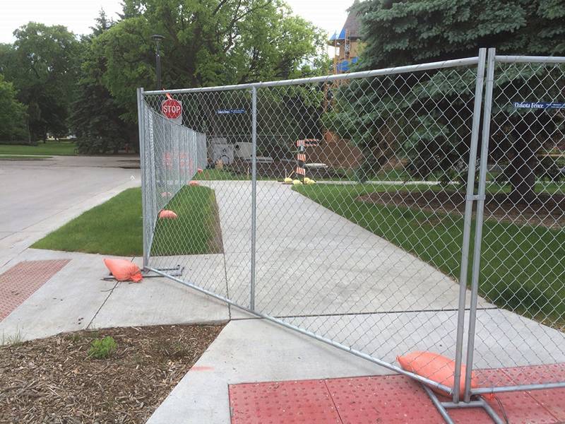 Temporary chain link fence panel placed in the construction site.