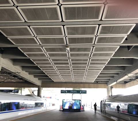 A roof of railway station consists of expanded metal panels.