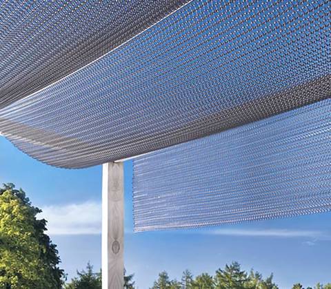 A ring mesh is support by some posts in an open air environment.