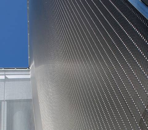 Wire rope woven mesh is built into building's facade to offer higher protection.