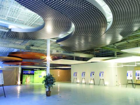 The exhibition hall is decorated with perforated ceilings.