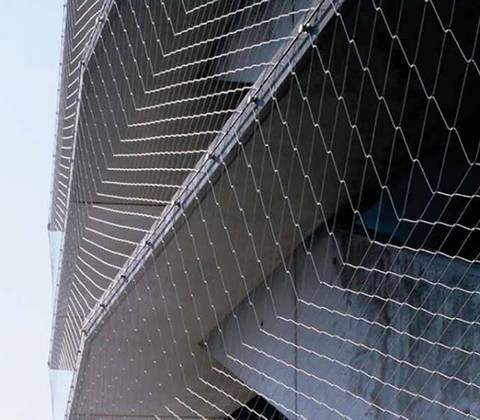 Wire rope mesh covers on the external of a modern building.