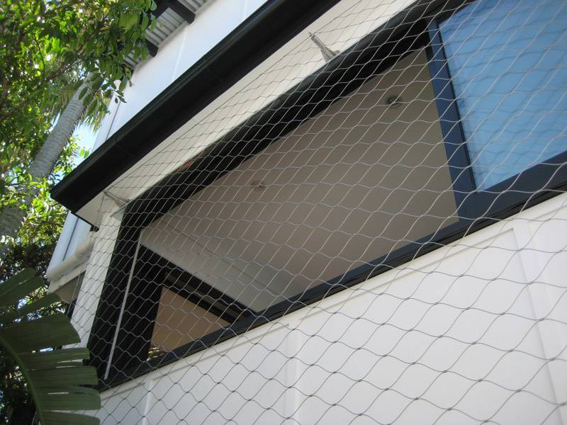 The picture shows that the cable mesh is installed on the building facade, providing transparent views.