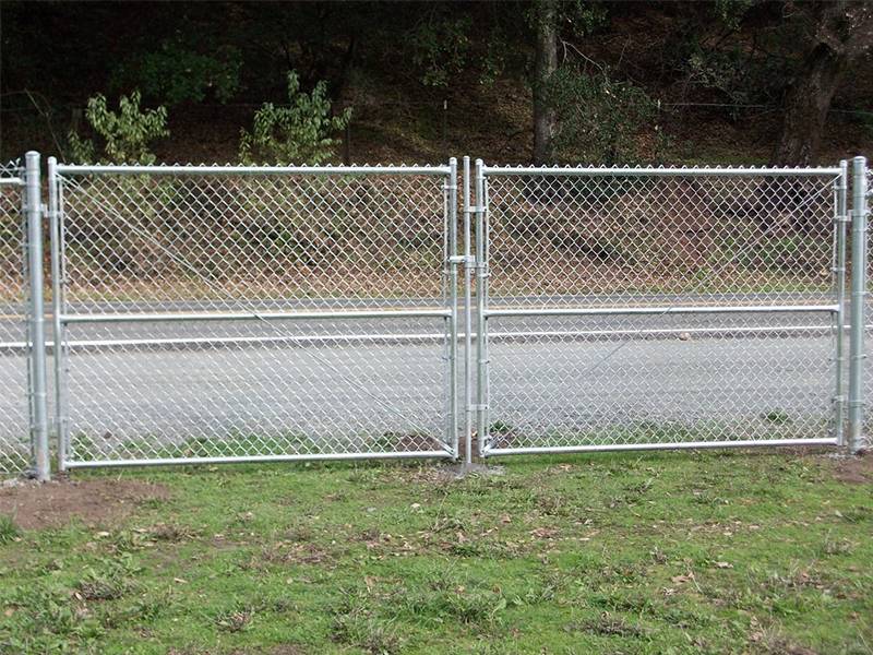 Galvanized chain link fence swing gate.