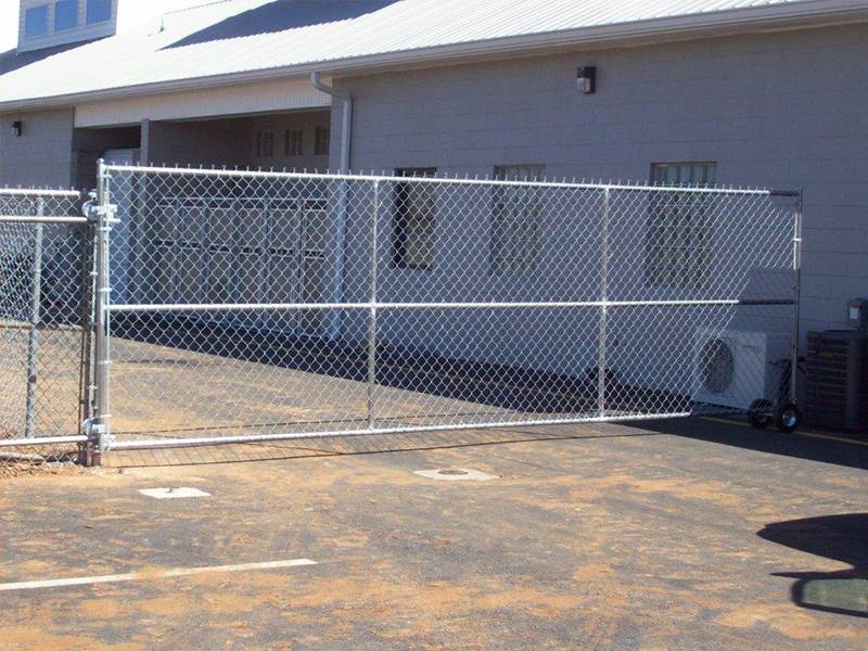 Chain link fence slide gate used in factory dormitory area. 