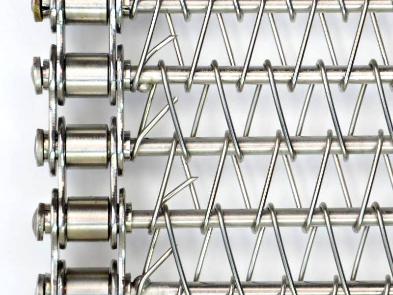 A flat spiral conveyor belt with round spirals and straight cross rods.