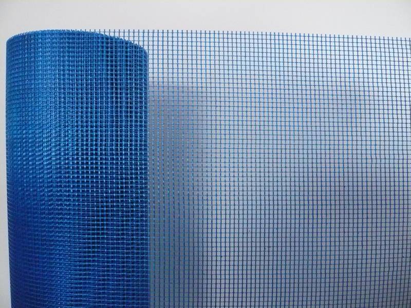 A roll of blue alkali resistant plaster fiberglass mesh.
