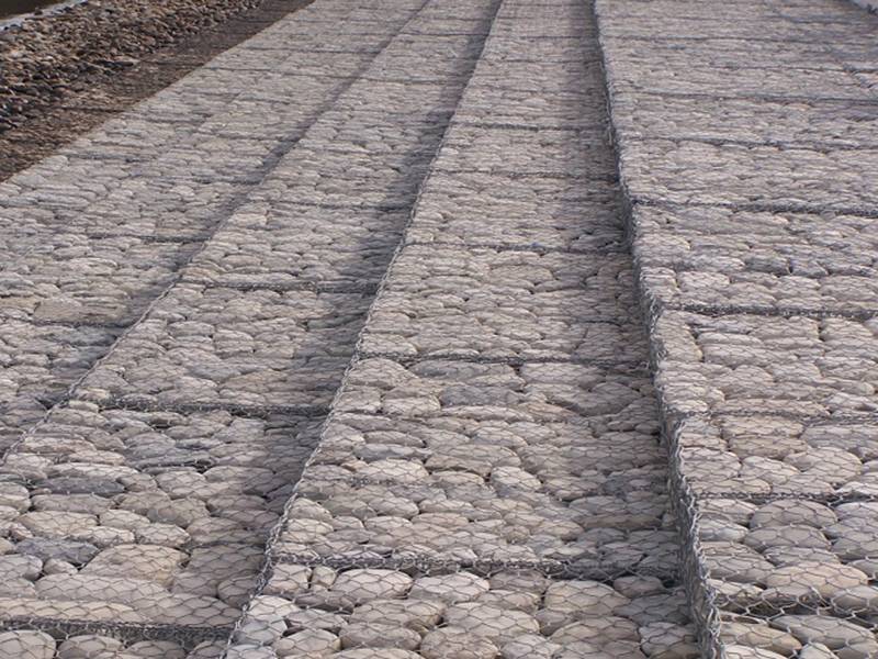 Woven gabion mattress beside the river.