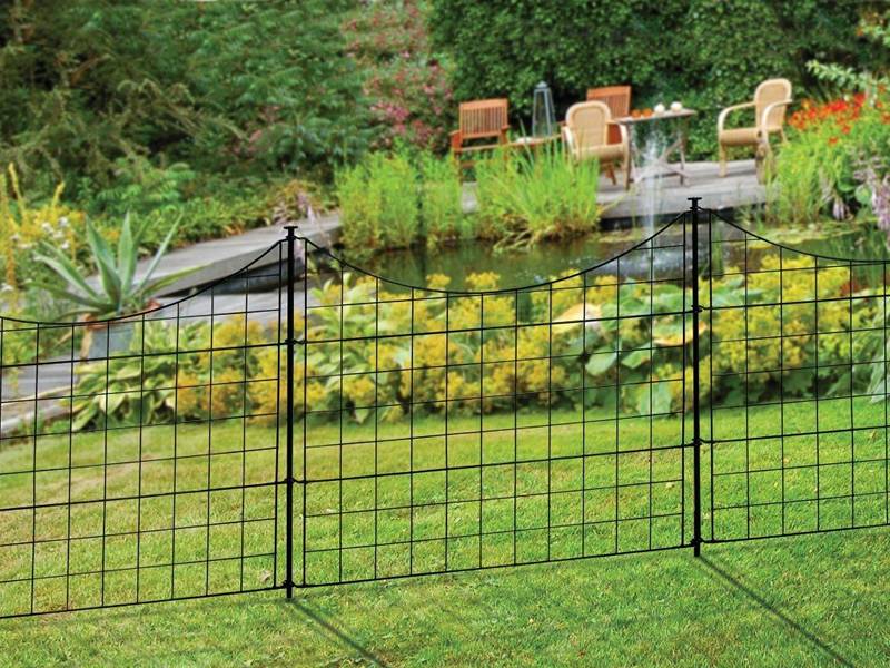 This is a beautiful garden with black welded wire garden fence.