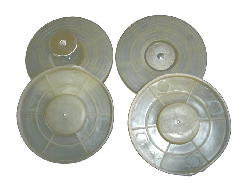 There are four white hot melt gaskets.