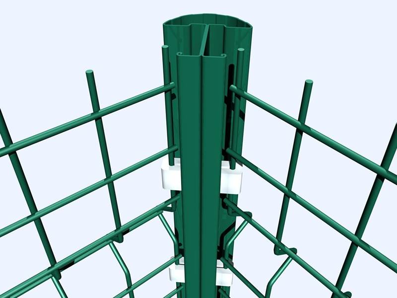 There is a green peach steel post installed with welded wire fence.