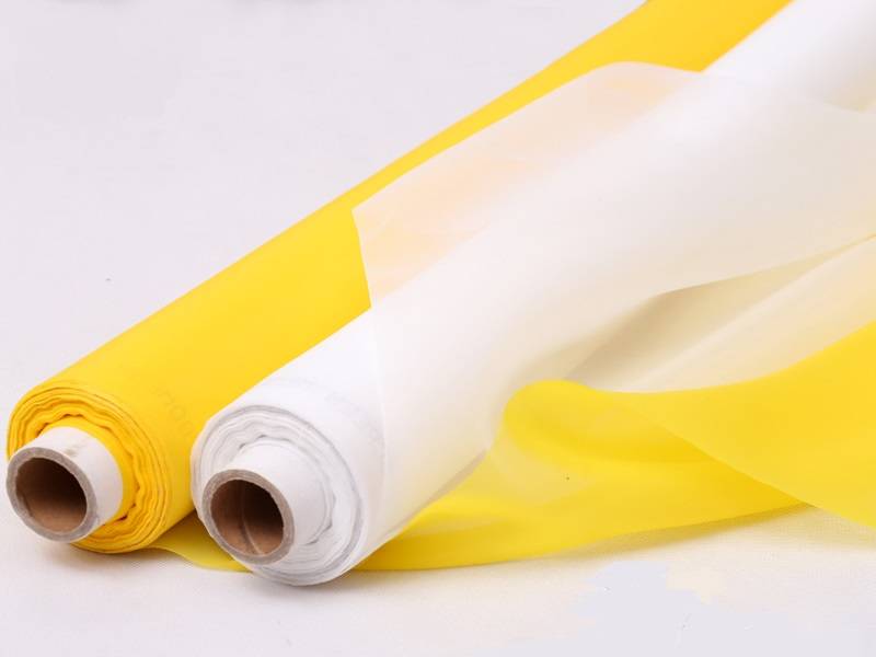 Two rolls of nylon printing screens, one is white, the other is yellow.