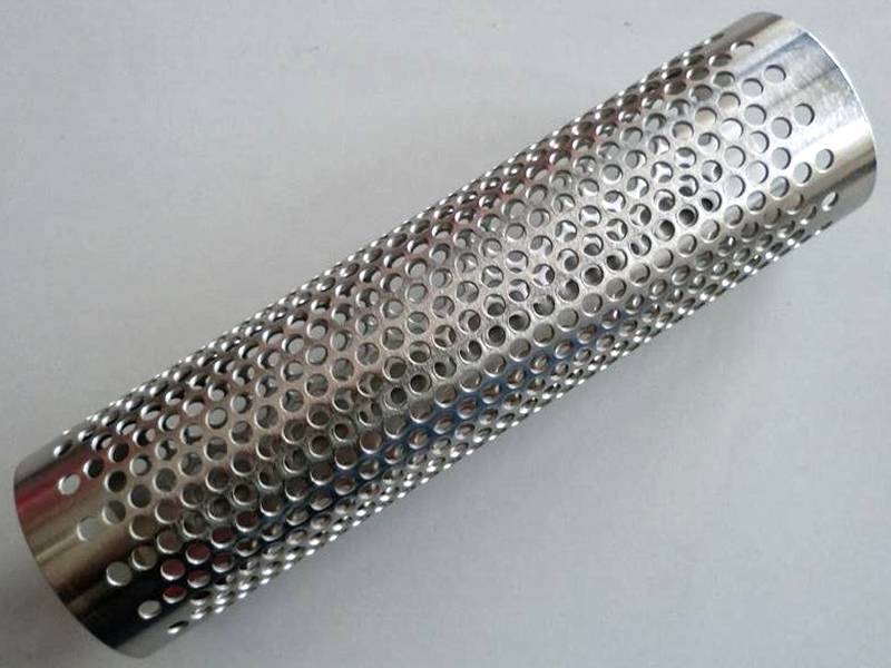 A galvanized perforated pipe with staggered round holes on the surface.