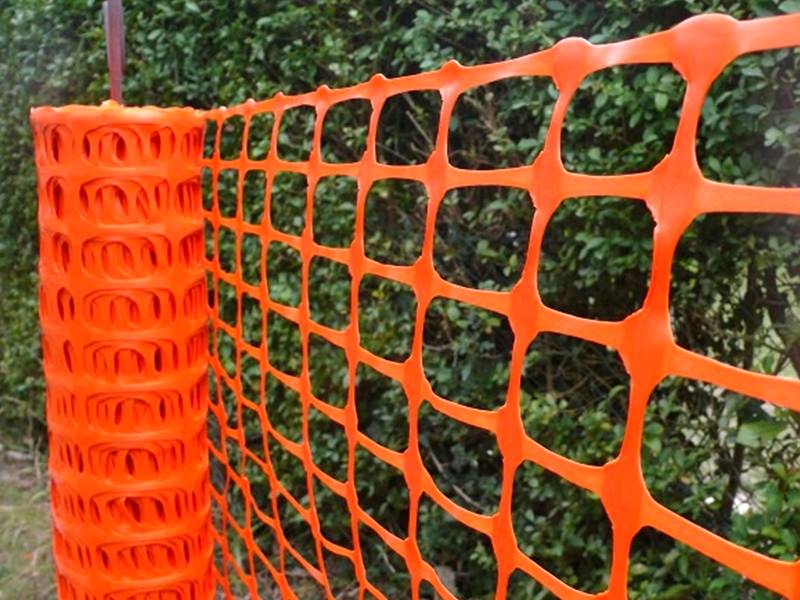 An orange Snow fence sheet is made of high density polyethylene