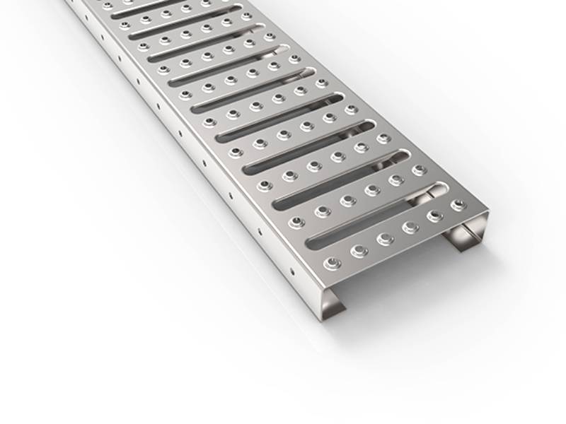Interlocking safety grating with serrated surface.