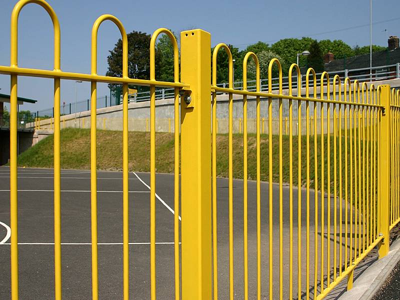 Yellow bow top fencing for roadside protection, it is attractive yet protective.
