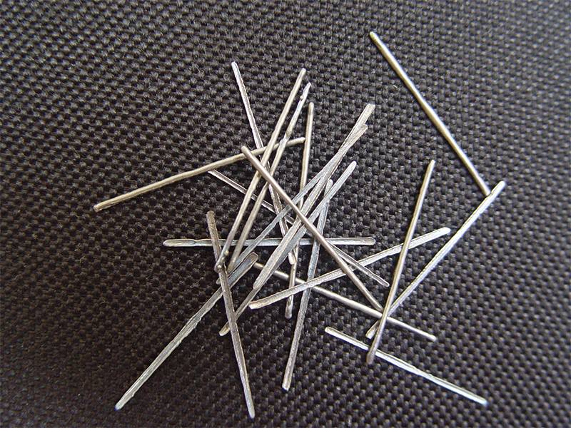 Some stainless steel fiber on a black sheet