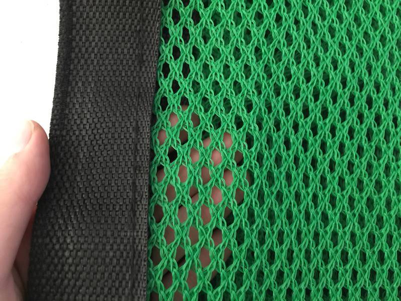 The green windbreak netting with reinforced edge shown.