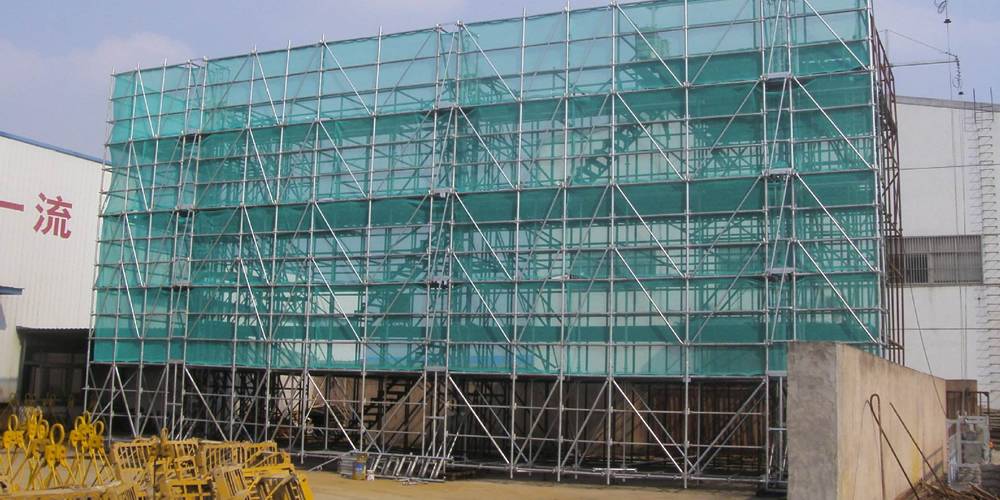 Protective measures such as scaffolds and safety nets used in the construction sites.