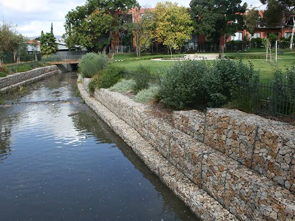 Double twisted gabion baskets are used for embankment protection.
