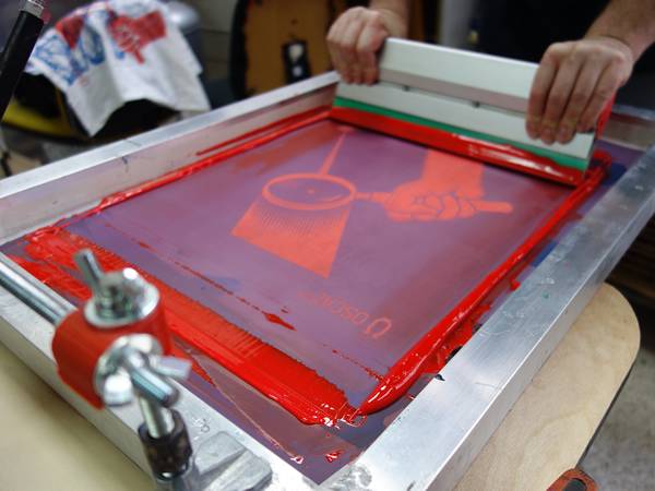 Screen printing process is adopted for T-shirt printing.